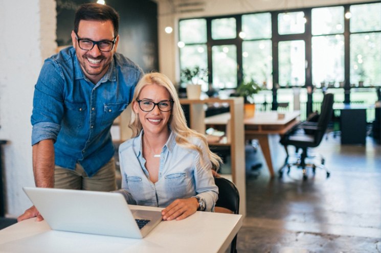 smiling man and woman representing small business owners